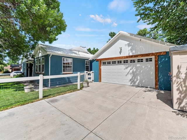 4540 Yarrow St, Wheat Ridge, CO 80033 - ranch-style house featuring a garage, a metal roof, a standing seam roof, and stucco siding