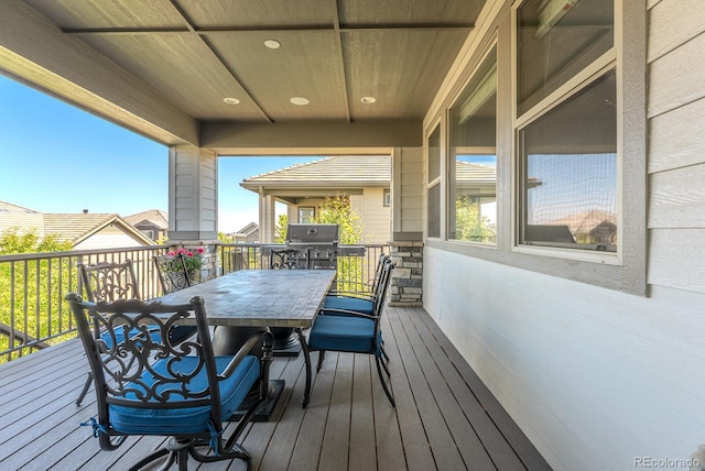 16383 Ute Peak Way, Broomfield, CO 80023 - wooden deck with outdoor dining space and grilling area