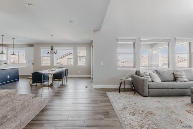 16383 Ute Peak Way, Broomfield, CO 80023 - living area with a chandelier, recessed lighting, and wood finished floors