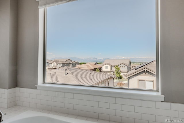 16383 Ute Peak Way, Broomfield, CO 80023 - bathroom with a bath, a residential view, and healthy amount of natural light