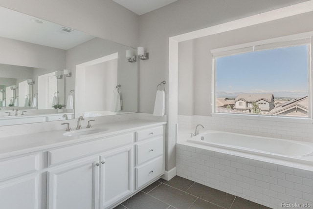 16383 Ute Peak Way, Broomfield, CO 80023 - bathroom with vanity, a bath, and tile patterned floors