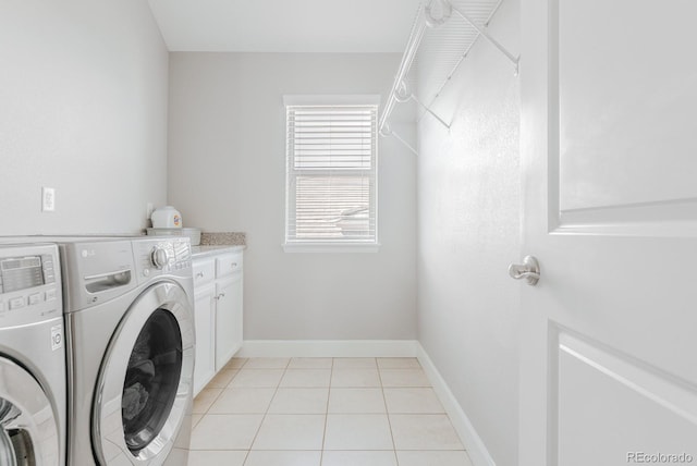 16383 Ute Peak Way, Broomfield, CO 80023 - laundry area featuring washer and clothes dryer, cabinet space, and light tile patterned floors