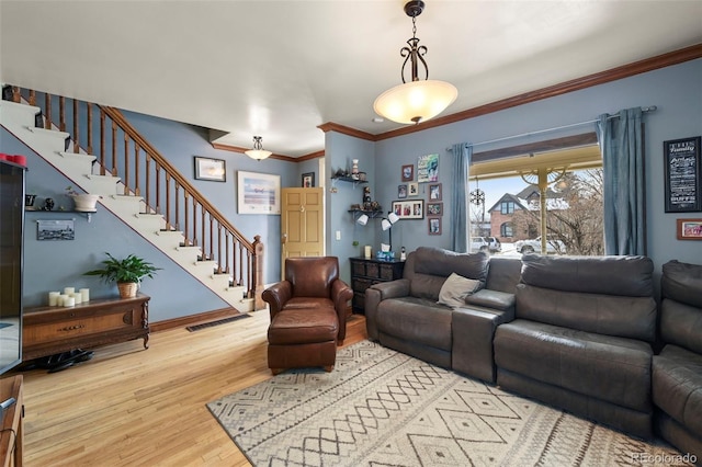 living room featuring hardwood / wood-style floors and ornamental molding