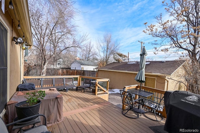 wooden deck featuring area for grilling