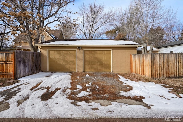 view of snow covered garage