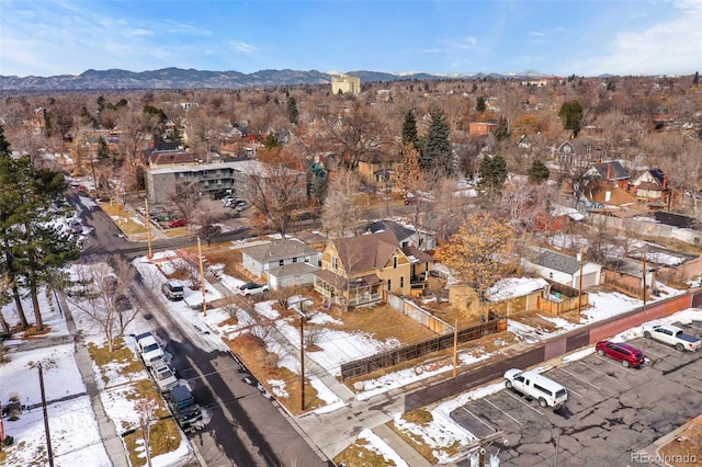 snowy aerial view featuring a mountain view