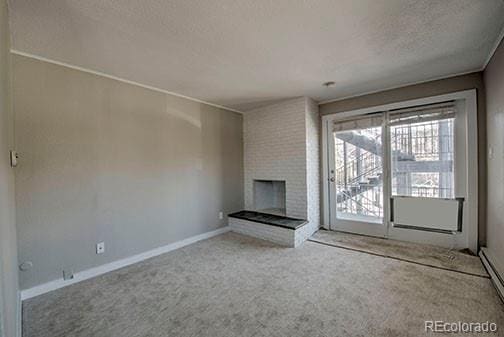 214 N Main St Unit 14, Breckenridge, CO 80424 - unfurnished living room with a textured ceiling, carpet floors, a brick fireplace, and baseboards