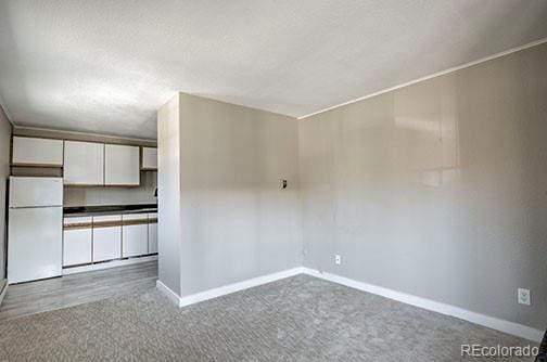 214 N Main St Unit 14, Breckenridge, CO 80424 - carpeted spare room with baseboards