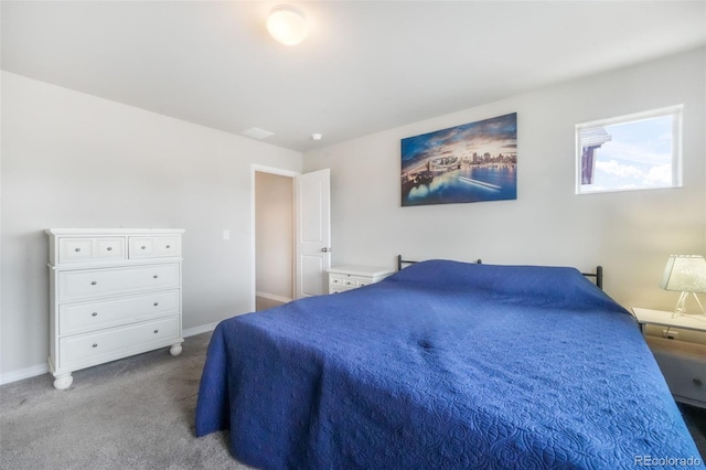 carpeted bedroom featuring baseboards