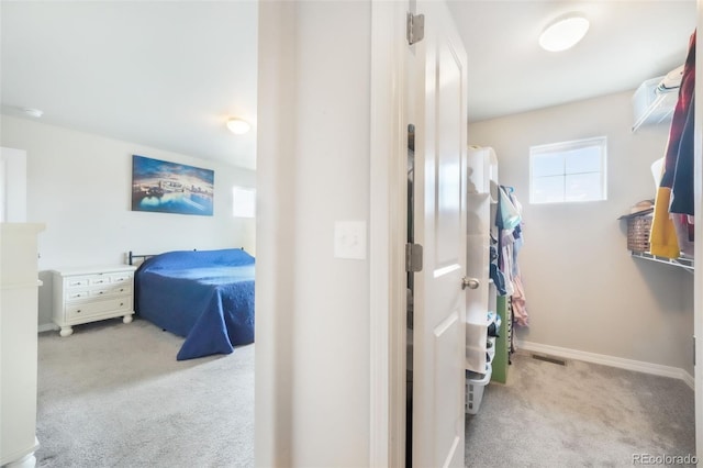 interior space featuring an AC wall unit and baseboards