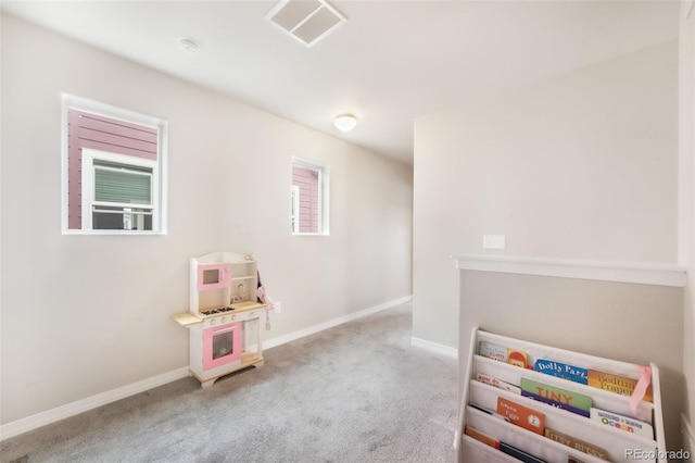 playroom with baseboards, visible vents, and carpet