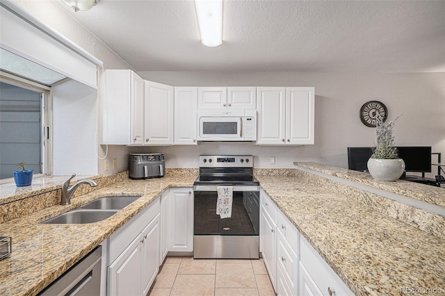 kitchen featuring sink, white cabinetry, and appliances with stainless steel finishes