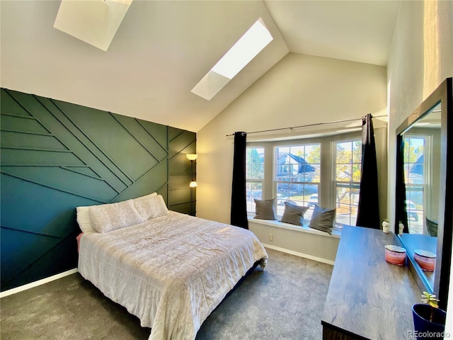 carpeted bedroom featuring vaulted ceiling with skylight