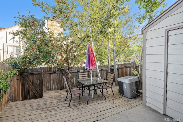 wooden deck featuring central air condition unit