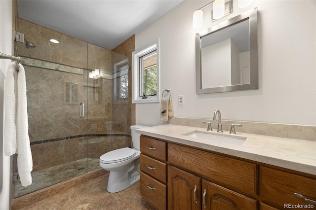 full bath with toilet, a stall shower, and vanity