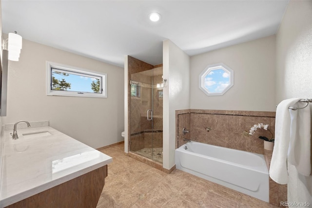 full bathroom featuring a stall shower, a garden tub, toilet, vanity, and tile patterned floors