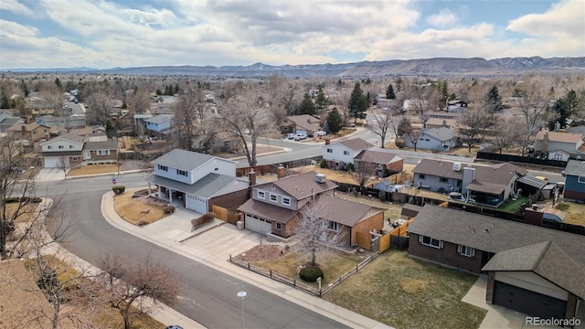 bird's eye view featuring a residential view and a mountain view