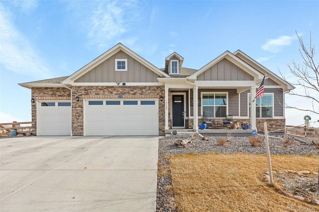 craftsman-style house featuring covered porch and a garage