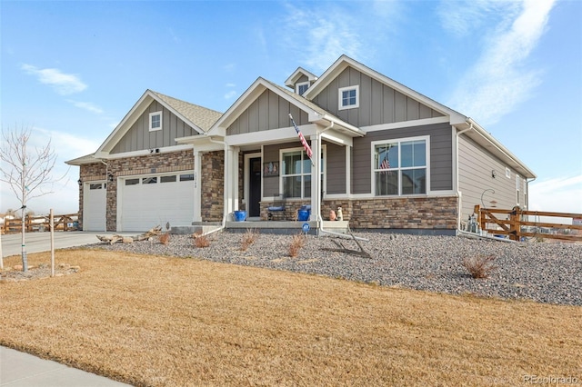 craftsman-style house with covered porch and a garage