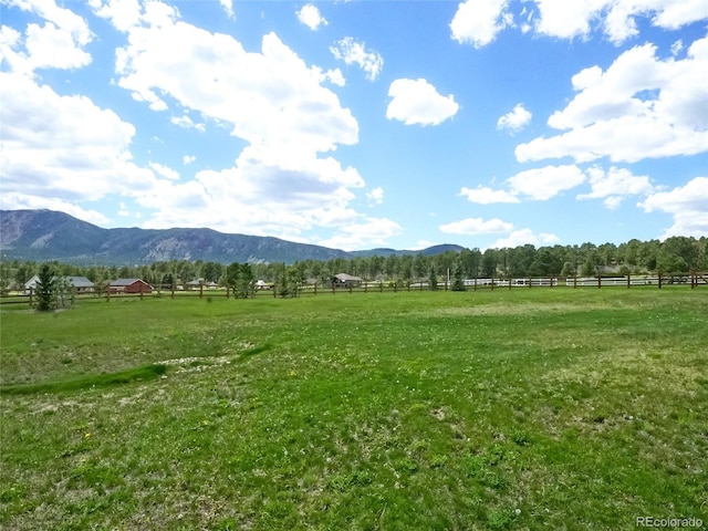 mountain view featuring a rural view