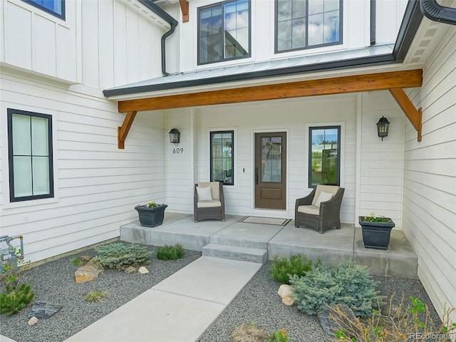 property entrance with a porch and board and batten siding