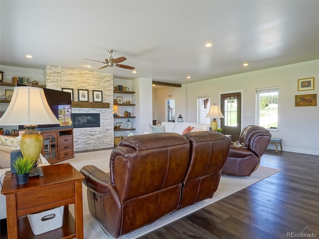 living room with wood finished floors, a fireplace, baseboards, recessed lighting, and a ceiling fan