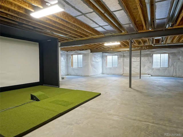basement with golf simulator