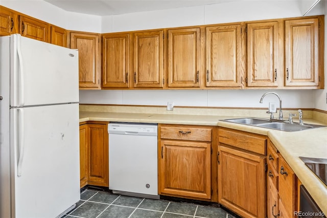 kitchen featuring white appliances and sink