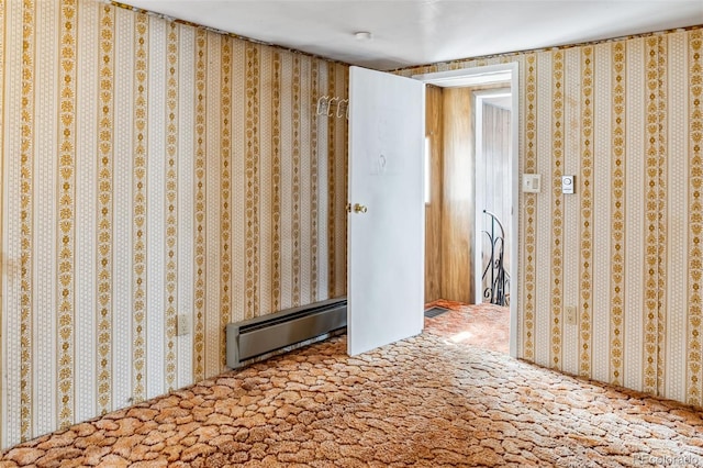 unfurnished bedroom featuring carpet floors and a baseboard radiator