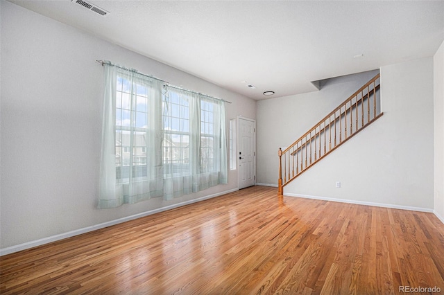 12710 Jasmine St Unit C, Thornton, CO 80602 - interior space with baseboards, stairs, wood finished floors, and visible vents
