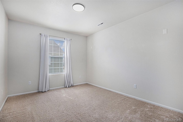 12710 Jasmine St Unit C, Thornton, CO 80602 - empty room with baseboards, light carpet, and visible vents