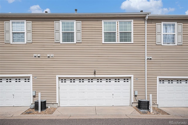 12710 Jasmine St Unit C, Thornton, CO 80602 - view of front of home featuring a garage and central air condition unit