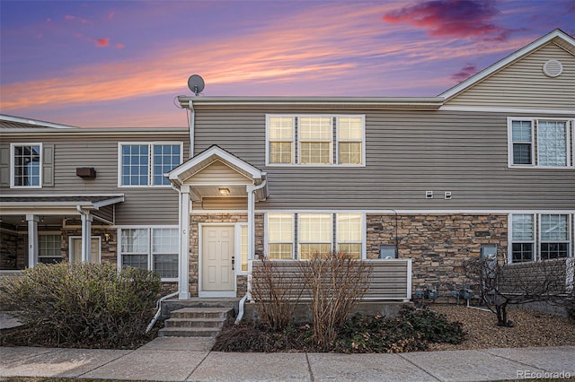 12710 Jasmine St Unit C, Thornton, CO 80602 - view of property featuring stone siding