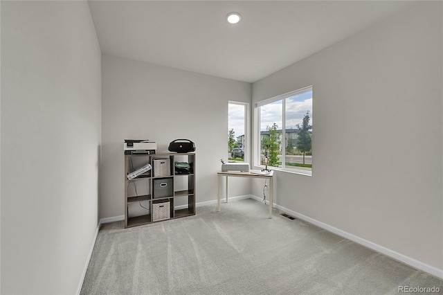 interior space featuring baseboards, recessed lighting, visible vents, and light colored carpet