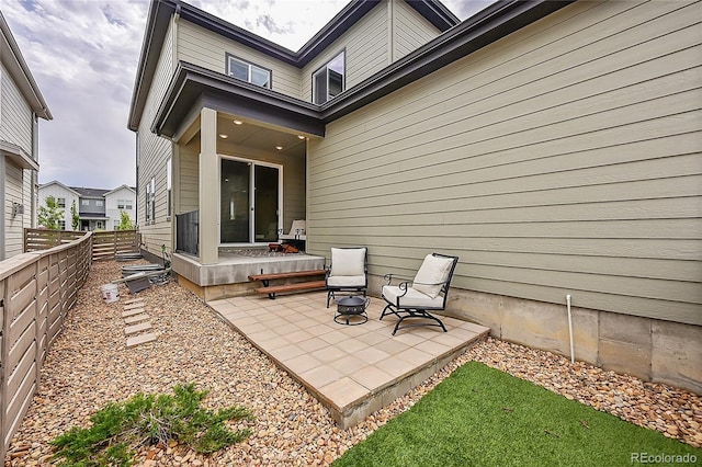 view of patio featuring fence