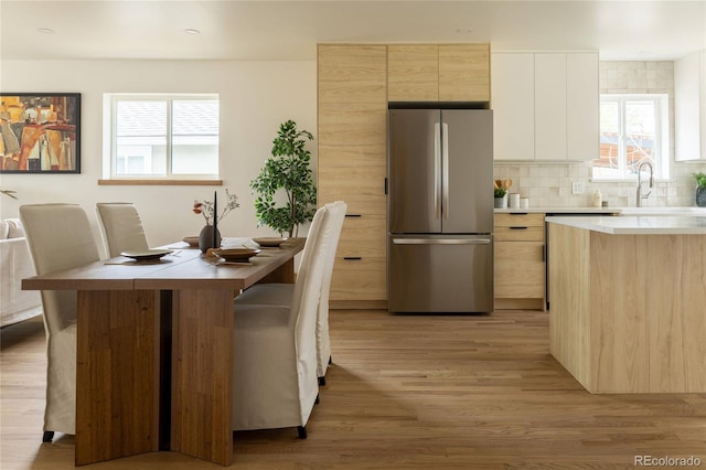 4631 Zuni St, Denver, CO 80211 - dining space featuring light wood-type flooring and plenty of natural light