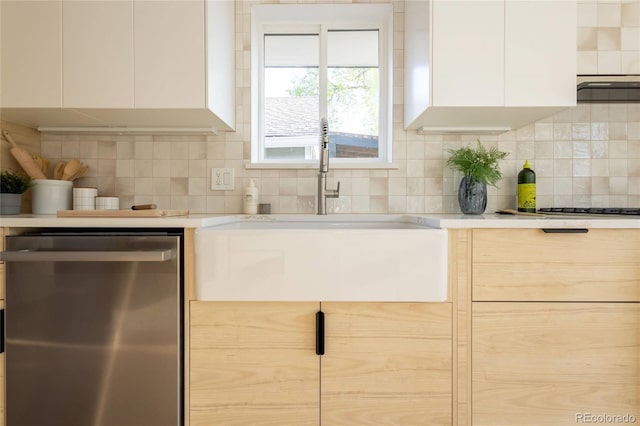 4631 Zuni St, Denver, CO 80211 - kitchen with dishwasher, a sink, decorative backsplash, and light countertops