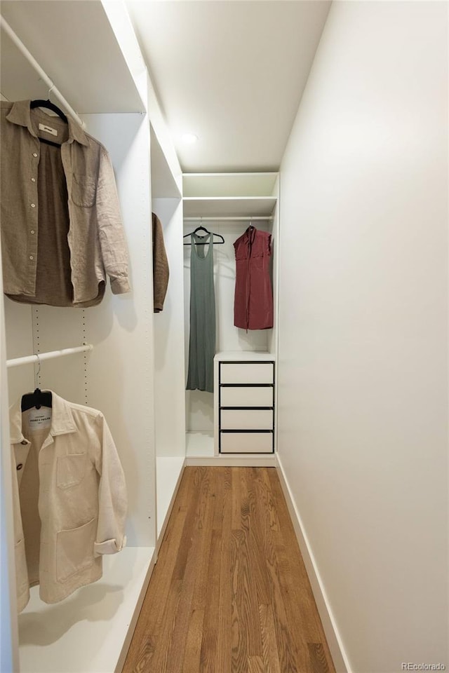 4631 Zuni St, Denver, CO 80211 - walk in closet featuring wood finished floors