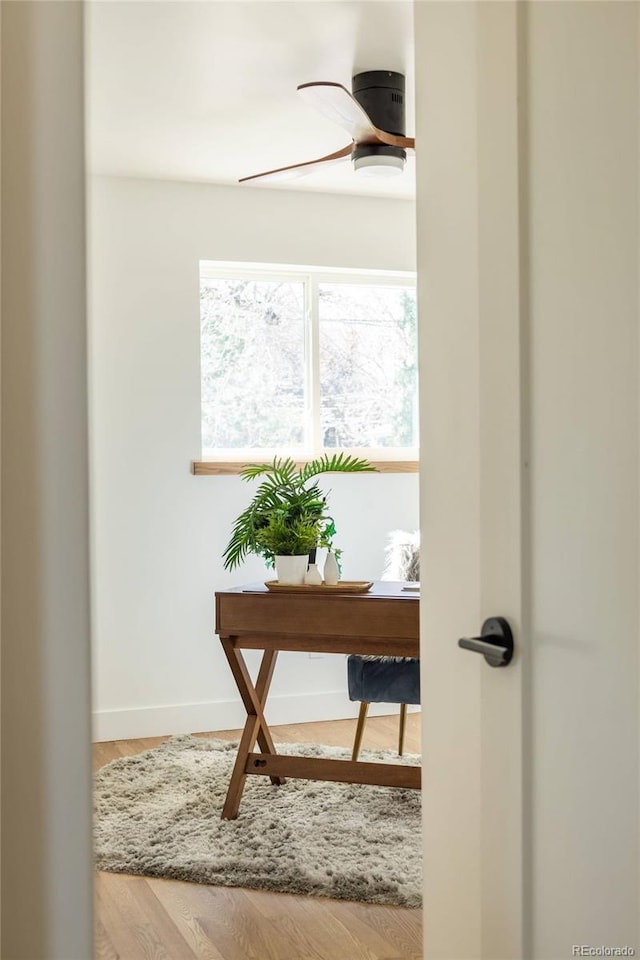 4631 Zuni St, Denver, CO 80211 - hallway with baseboards, an office area, and wood finished floors