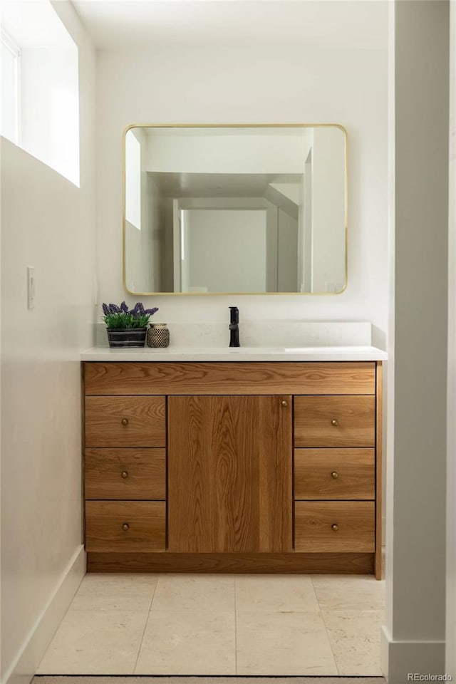 4631 Zuni St, Denver, CO 80211 - bathroom featuring baseboards, vanity, and tile patterned floors
