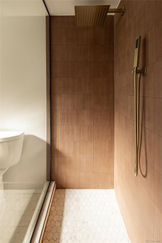 4631 Zuni St, Denver, CO 80211 - bathroom featuring a tile shower and tile patterned flooring