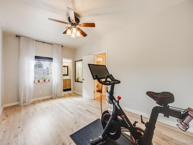 exercise area with light wood-style flooring, baseboards, and ceiling fan