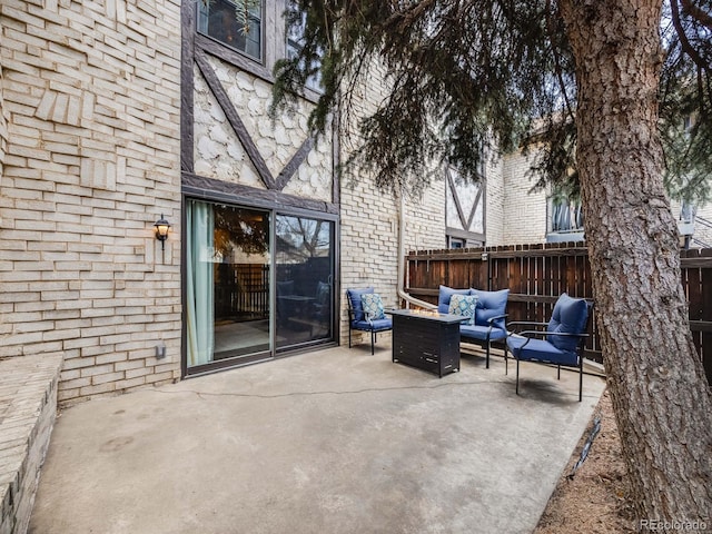 view of patio with fence and an outdoor living space