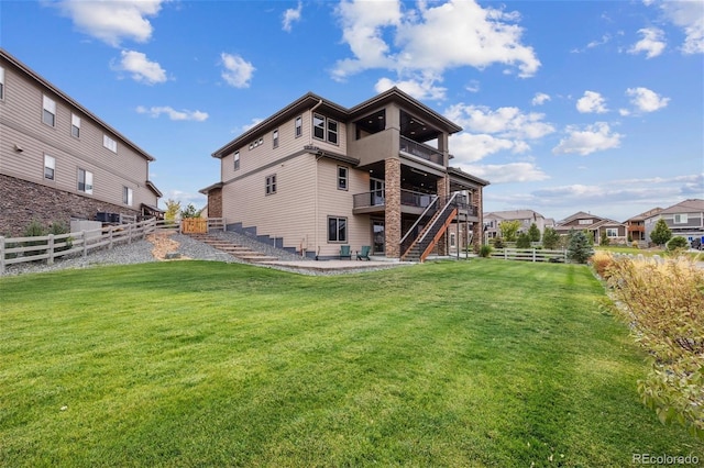 16371 Jones Mountain Way, Broomfield, CO 80023 - back of house featuring stairway, a patio area, a balcony, and a wooden deck