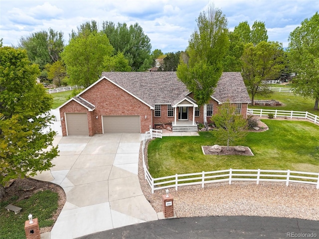 ranch-style home with a front yard and a garage