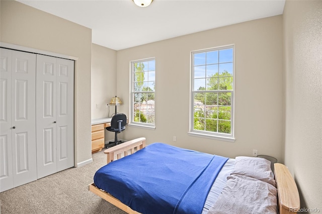 carpeted bedroom with a closet