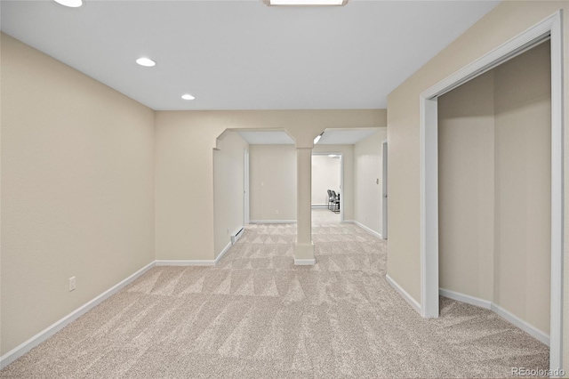 hall featuring light colored carpet