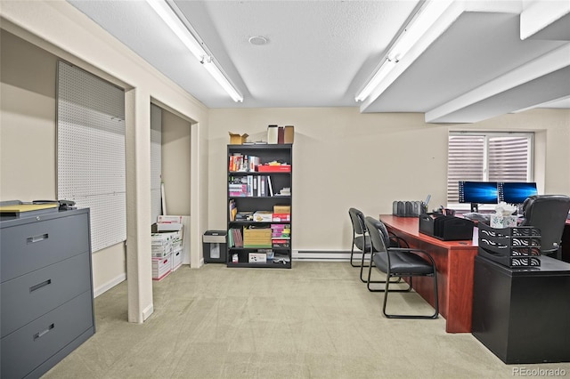 office space with a textured ceiling, baseboard heating, and light colored carpet