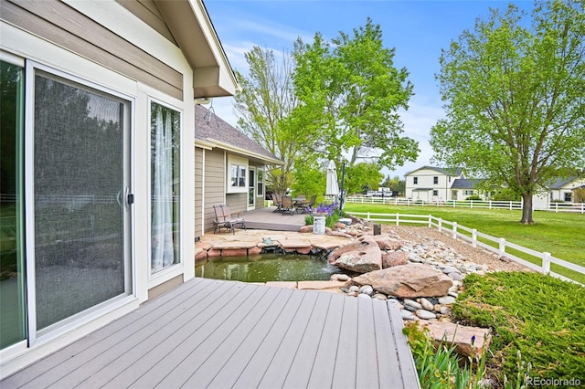 wooden deck with a yard