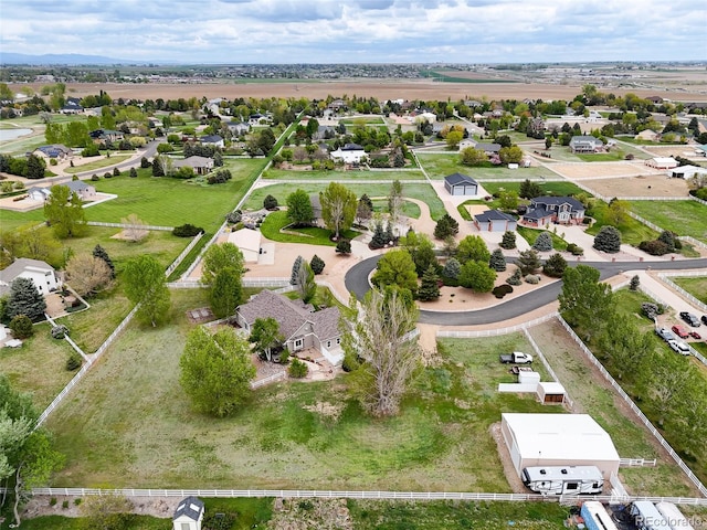 birds eye view of property with a residential view